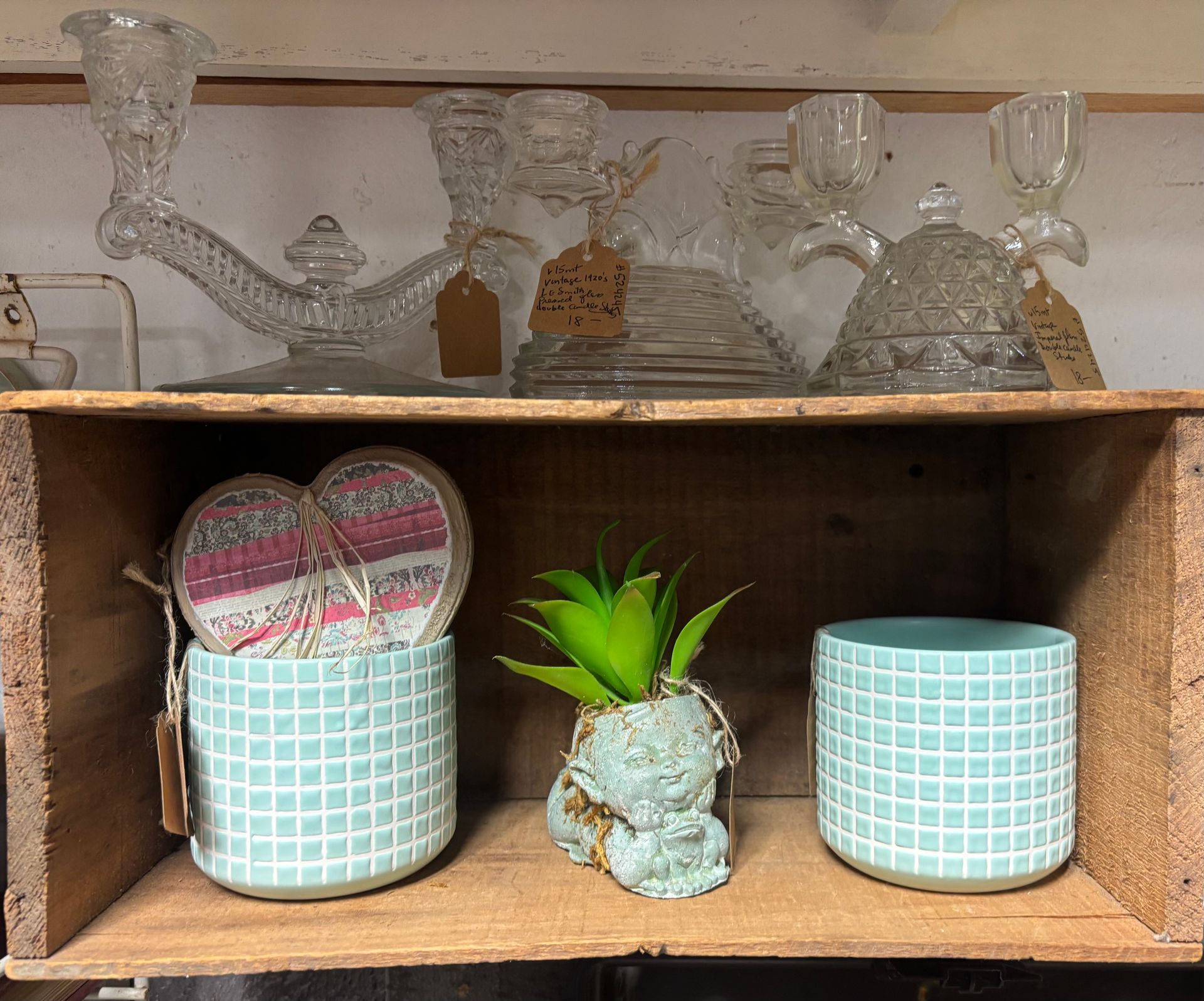 various glass bottles, globes, and decorative objects.