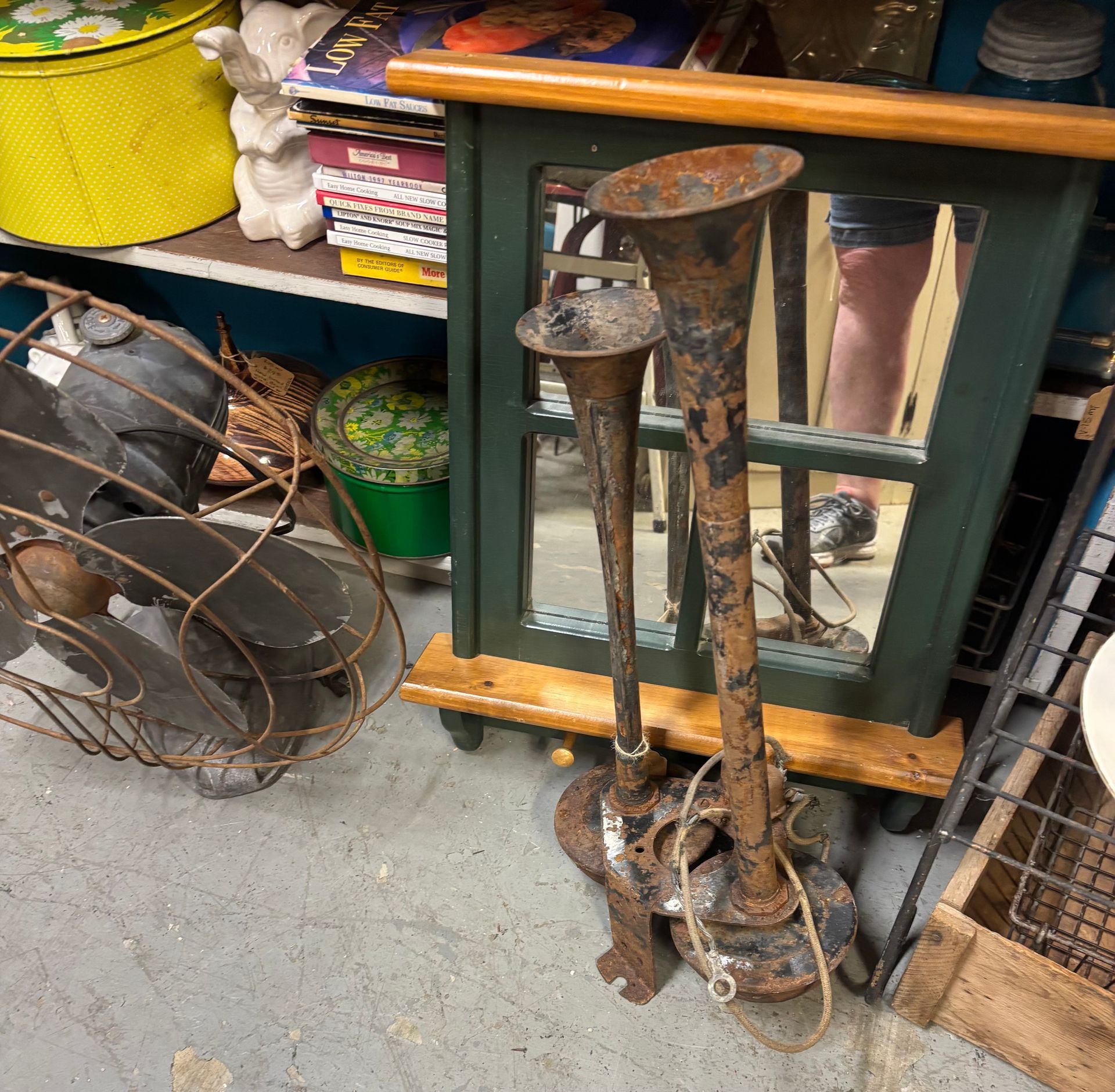 gold candle holders, flowers, and a book