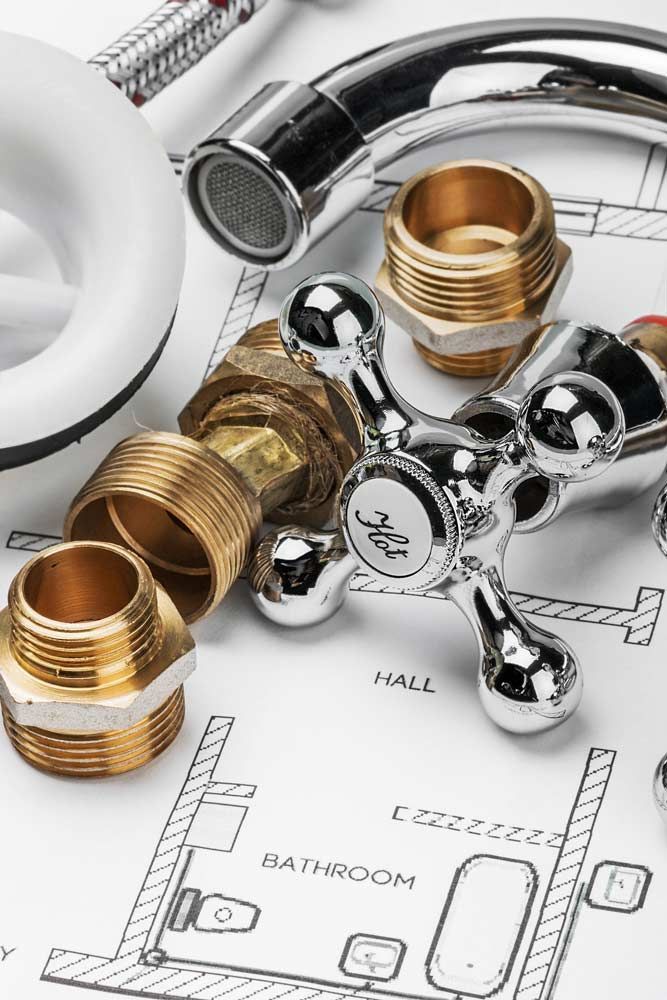 A close up of plumbing parts on a blueprint