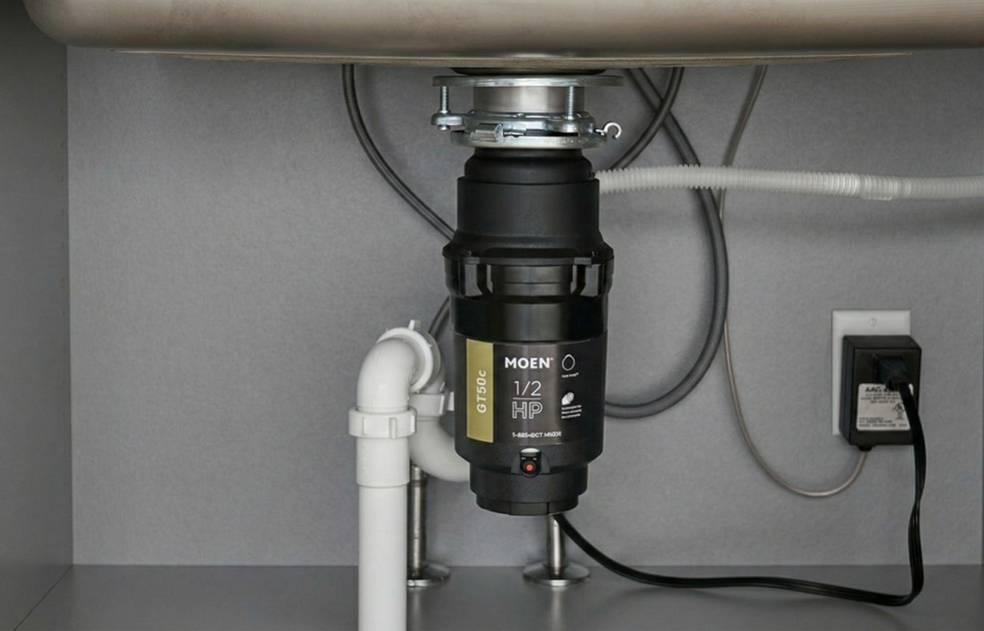 Rusty outdoor faucet with a red handle and a single water drop.