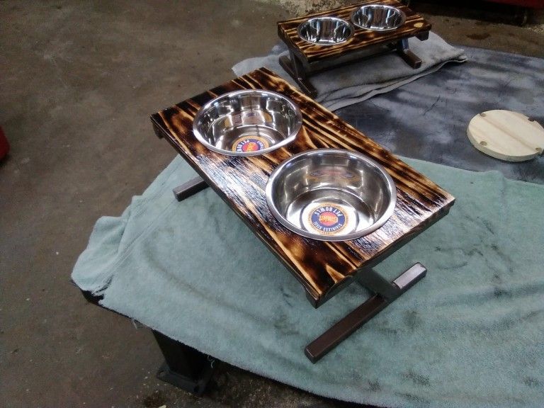 Two stainless steel bowl dog dish stand with welded metal frame and beautiful wood top.