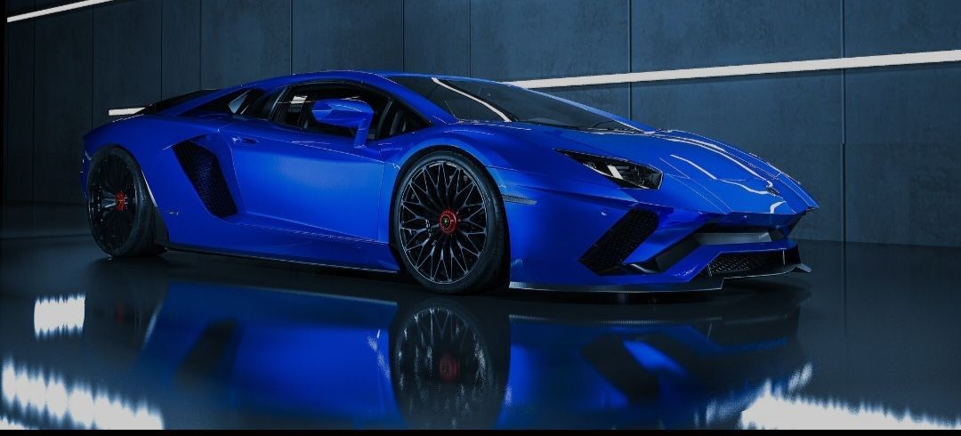 A blue lamborghini aventador is parked in a garage.