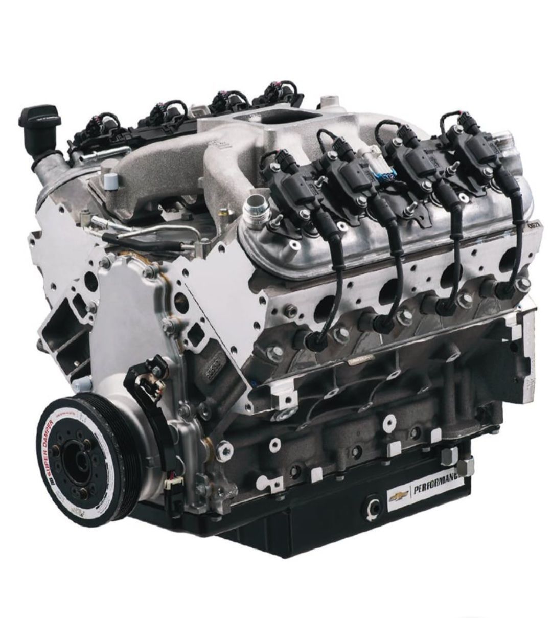 A close up of a chevrolet engine on a white background