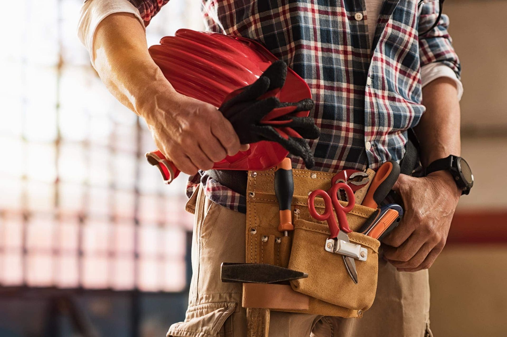 Handyman holding power tools