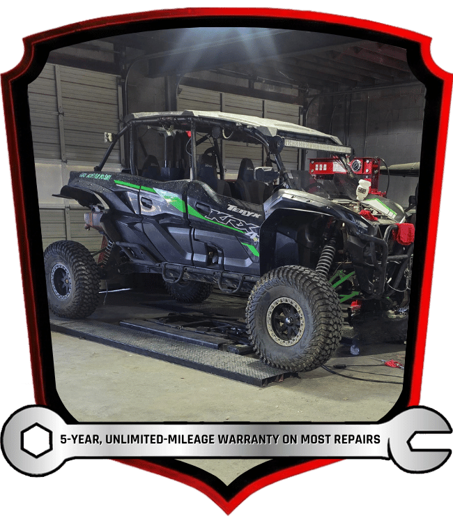 Off-road side by side vehicle on lift during repair and maintenance service