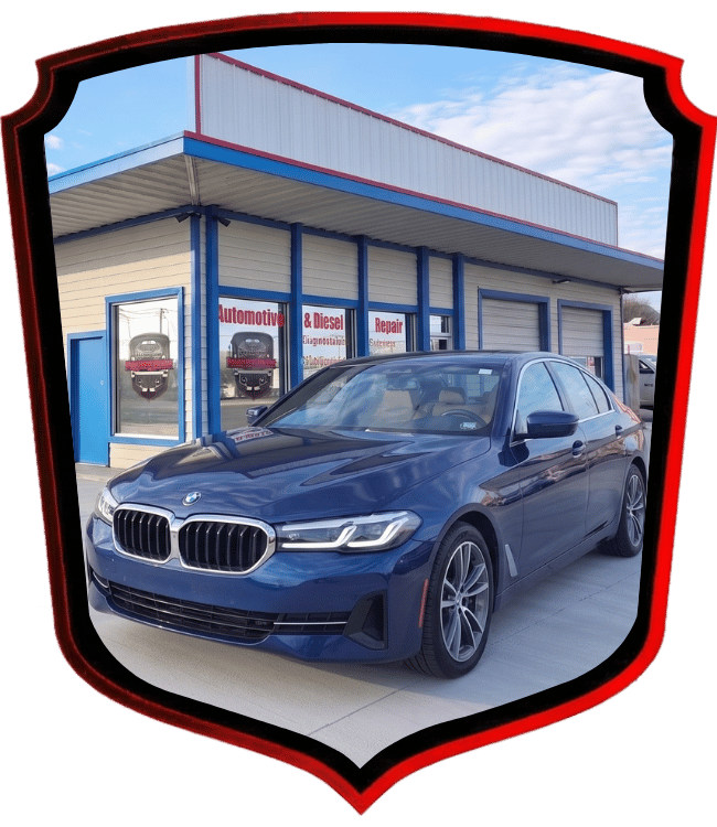 Blue BMW sedan outside WrenchWerks automotive and diesel repair shop