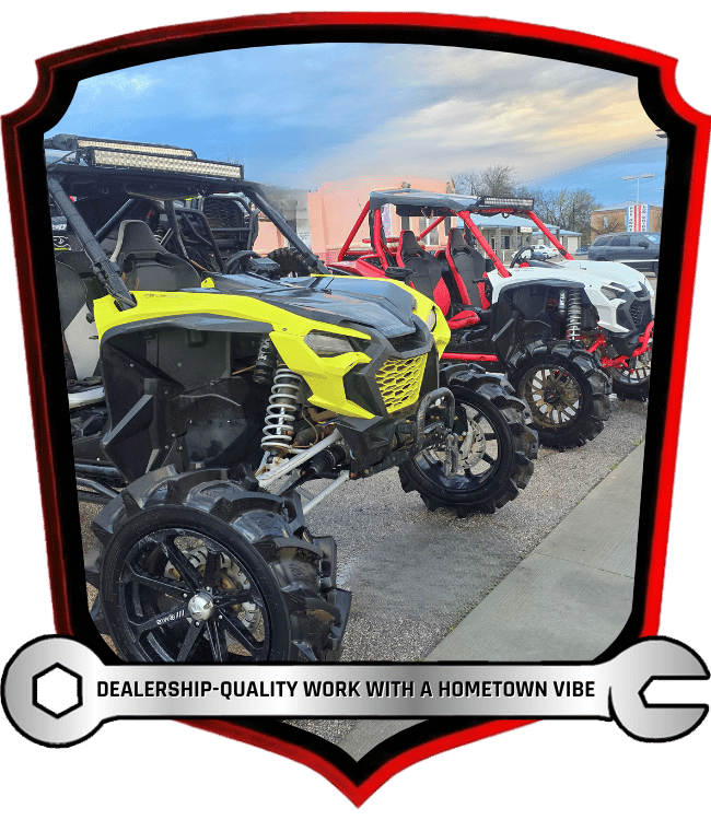 Custom off-road side-by-side vehicles lined up outdoors
