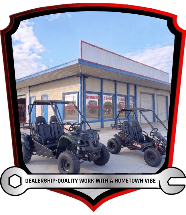 Coleman go-karts parked outside automotive repair facility