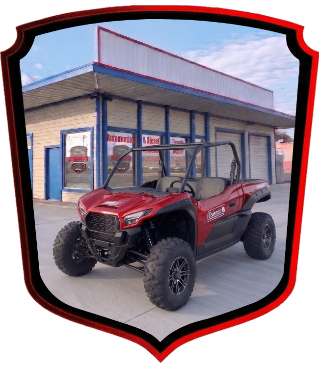 Red Coleman off-road utility vehicle parked outside WrenchWerks shop