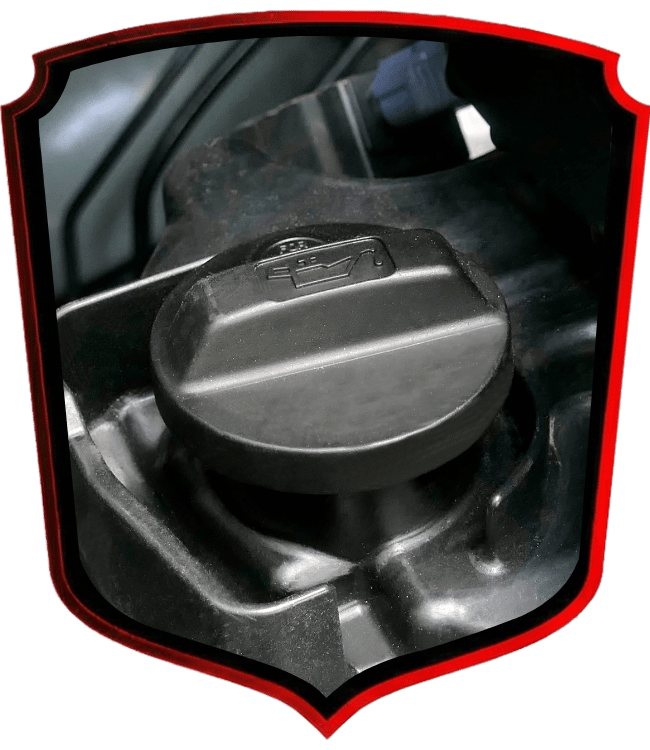 Black engine oil cap on vehicle engine component