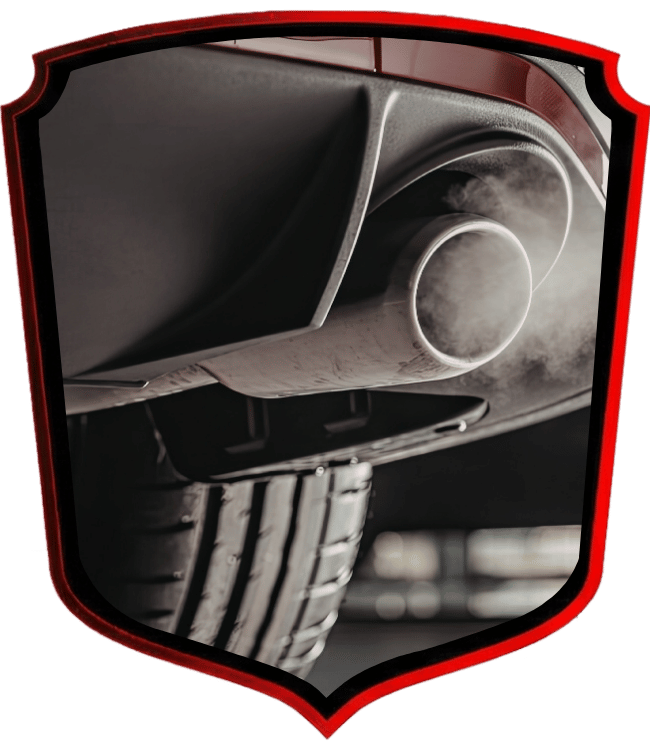 Vehicle exhaust pipe emitting smoke from muffler system