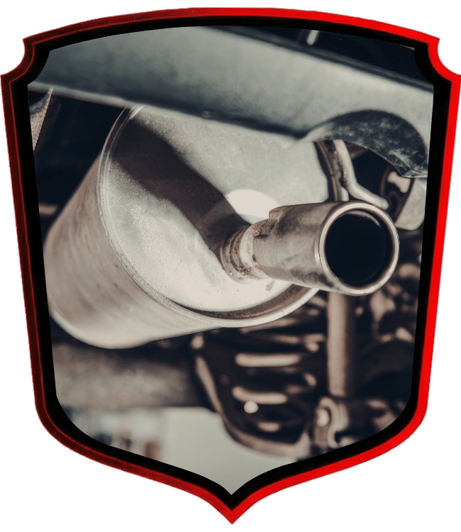 Rusty exhaust muffler and tailpipe underneath vehicle