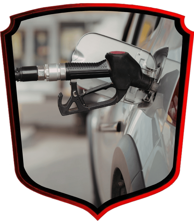 Fuel nozzle pumping gasoline into vehicle fuel tank