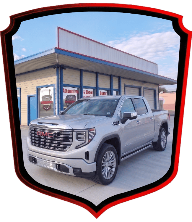 Silver GMC Sierra pickup truck parked outside WrenchWerks repair shop