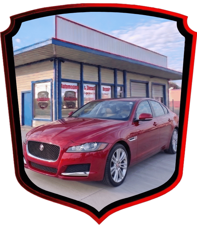 Red Jaguar luxury sedan parked outside WrenchWerks auto repair facility