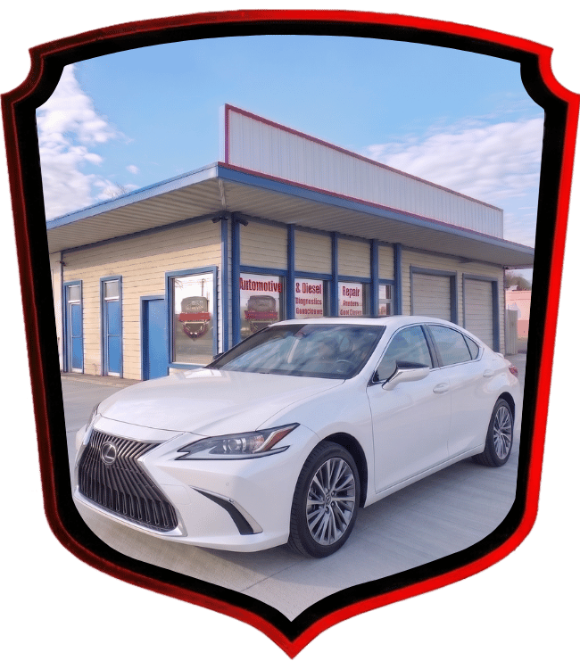 White Lexus luxury sedan parked outside WrenchWerks automotive shop