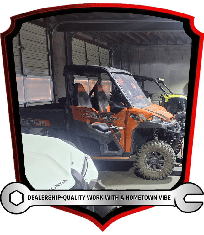 Polaris Ranger side-by-side parked inside service garage