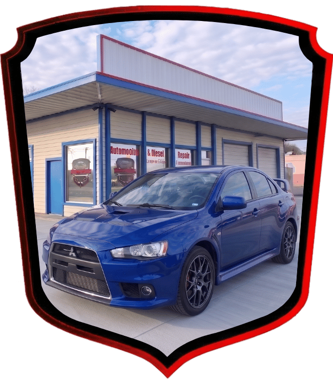 Blue Mitsubishi Lancer Evolution parked outside WrenchWerks repair shop