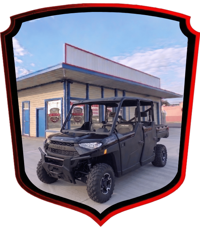 Black Polaris Ranger utility vehicle parked outside WrenchWerks shop