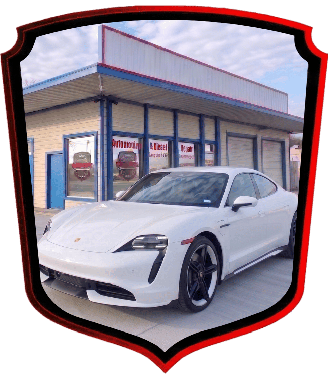 White Porsche Taycan electric sports sedan outside WrenchWerks repair facility
