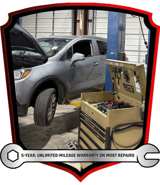 SUV in auto repair shop with tool cart during tire and maintenance service