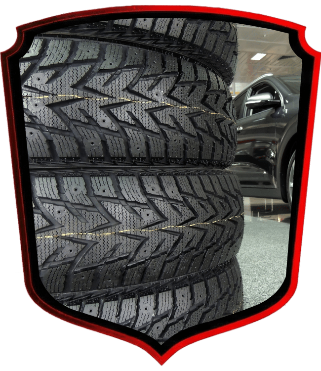Stacked winter tires displayed inside automotive shop