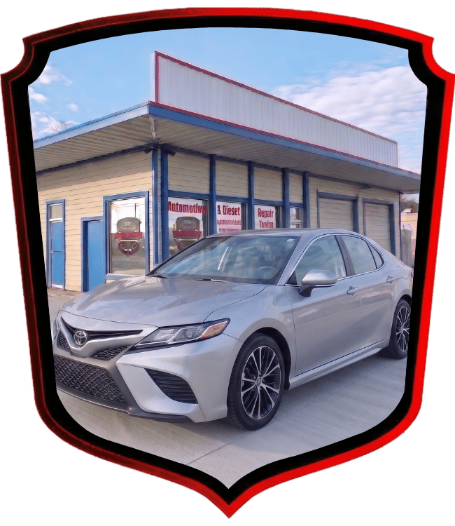 Silver Toyota Camry sedan parked outside WrenchWerks repair facility