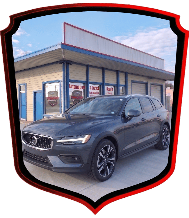 Gray Volvo SUV parked outside WrenchWerks repair shop
