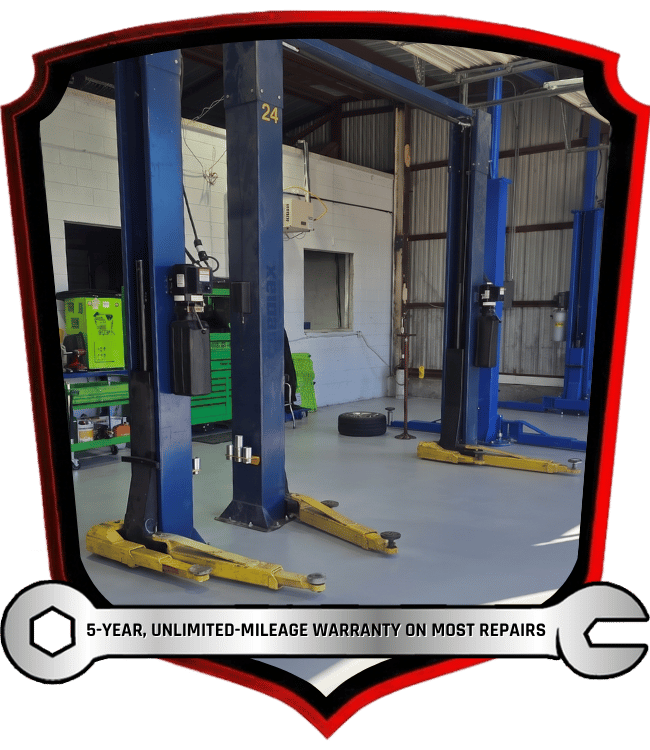 Clean automotive repair shop with vehicle lifts and service equipment