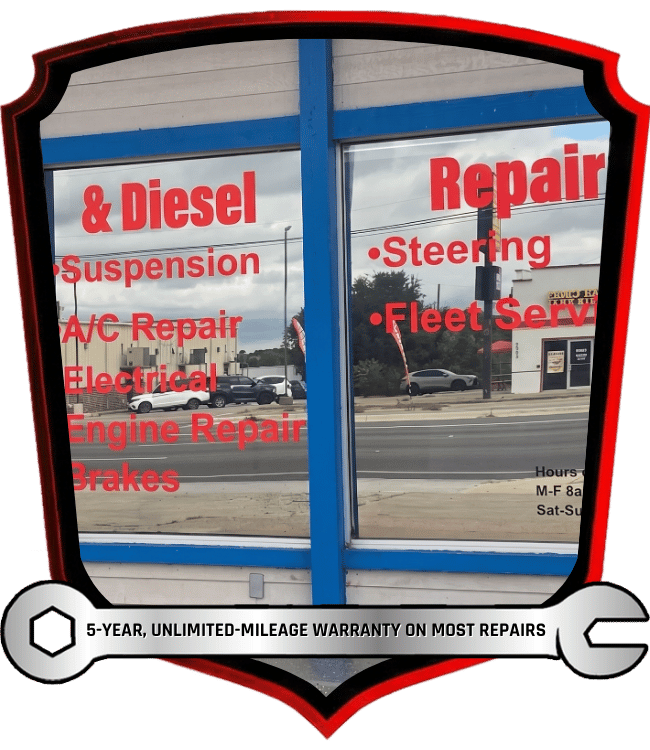 Automotive and diesel repair services listed on repair shop storefront window