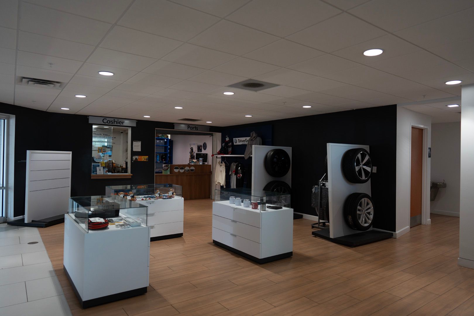 A large room with a lot of displays and tires on the wall