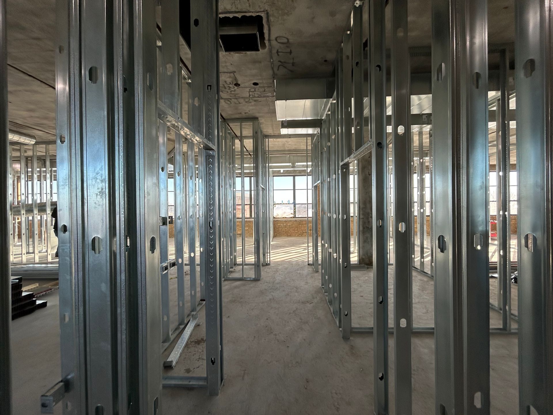 A building under construction with a lot of metal frames