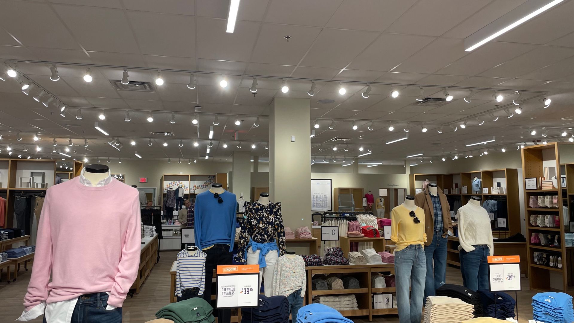 A store filled with lots of clothes and mannequins.