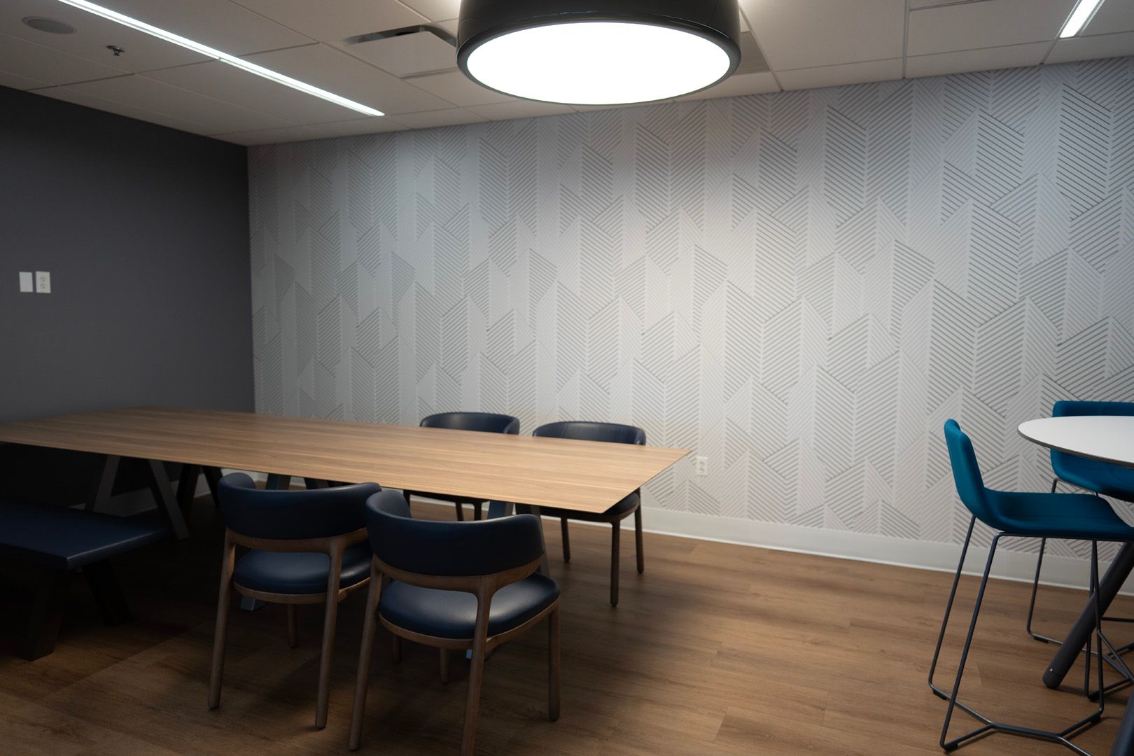 There is a table and chairs in the room.