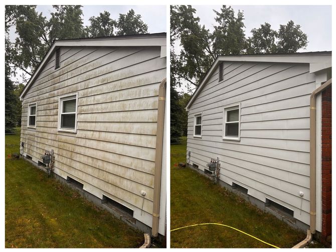A before and after photo of a house 's siding being cleaned.