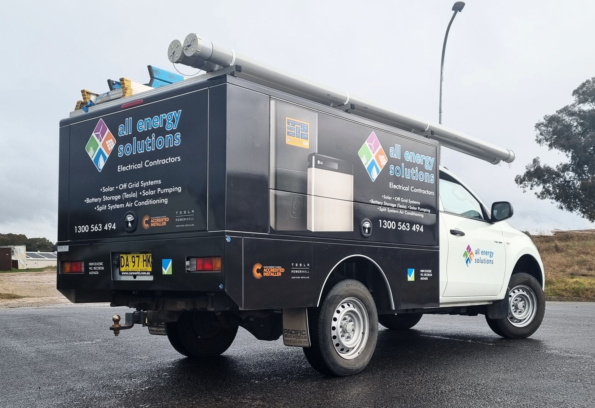 A White Truck With a Black Box That Says 'Scaffolding Solutions' on It — Robinsons Sign Makers in Lavington, NSW