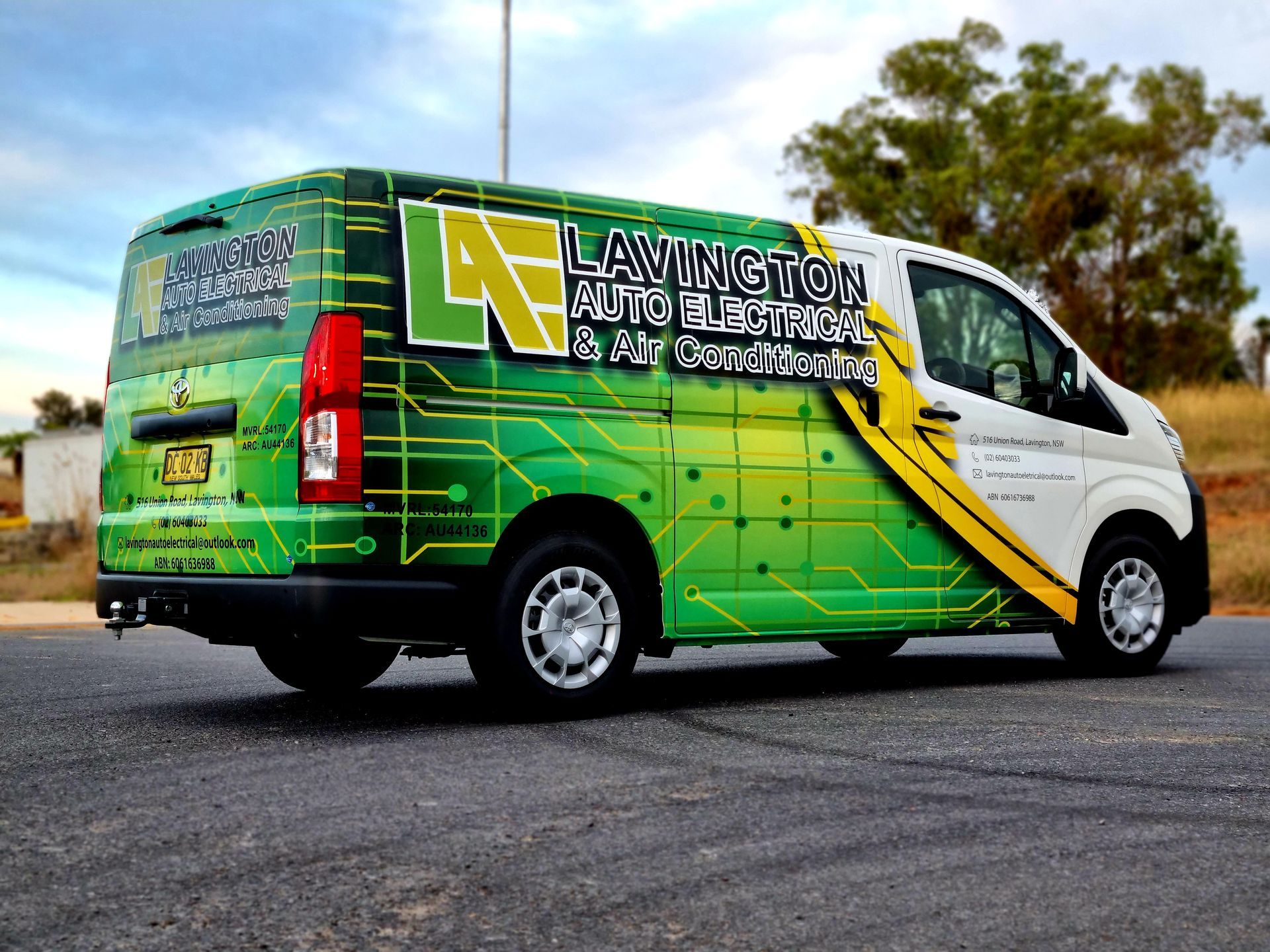 A Green and White Van is Parked on the Side of the Road — Robinsons Sign Makers in Lavington, NSW