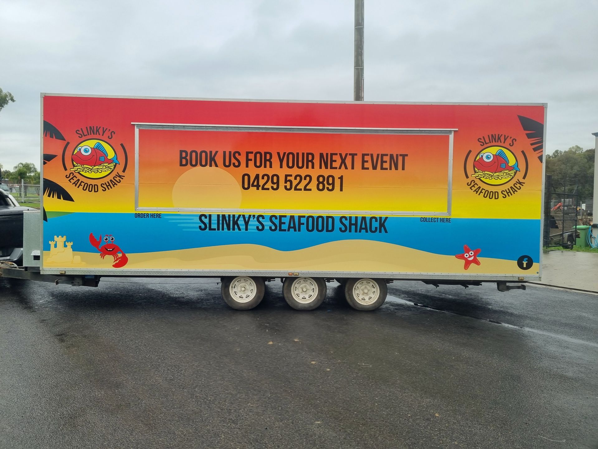 A Trailer for Slinky 's Seafood Shack is Parked on the Side of the Road — Robinsons Sign Makers in Lavington, NSW