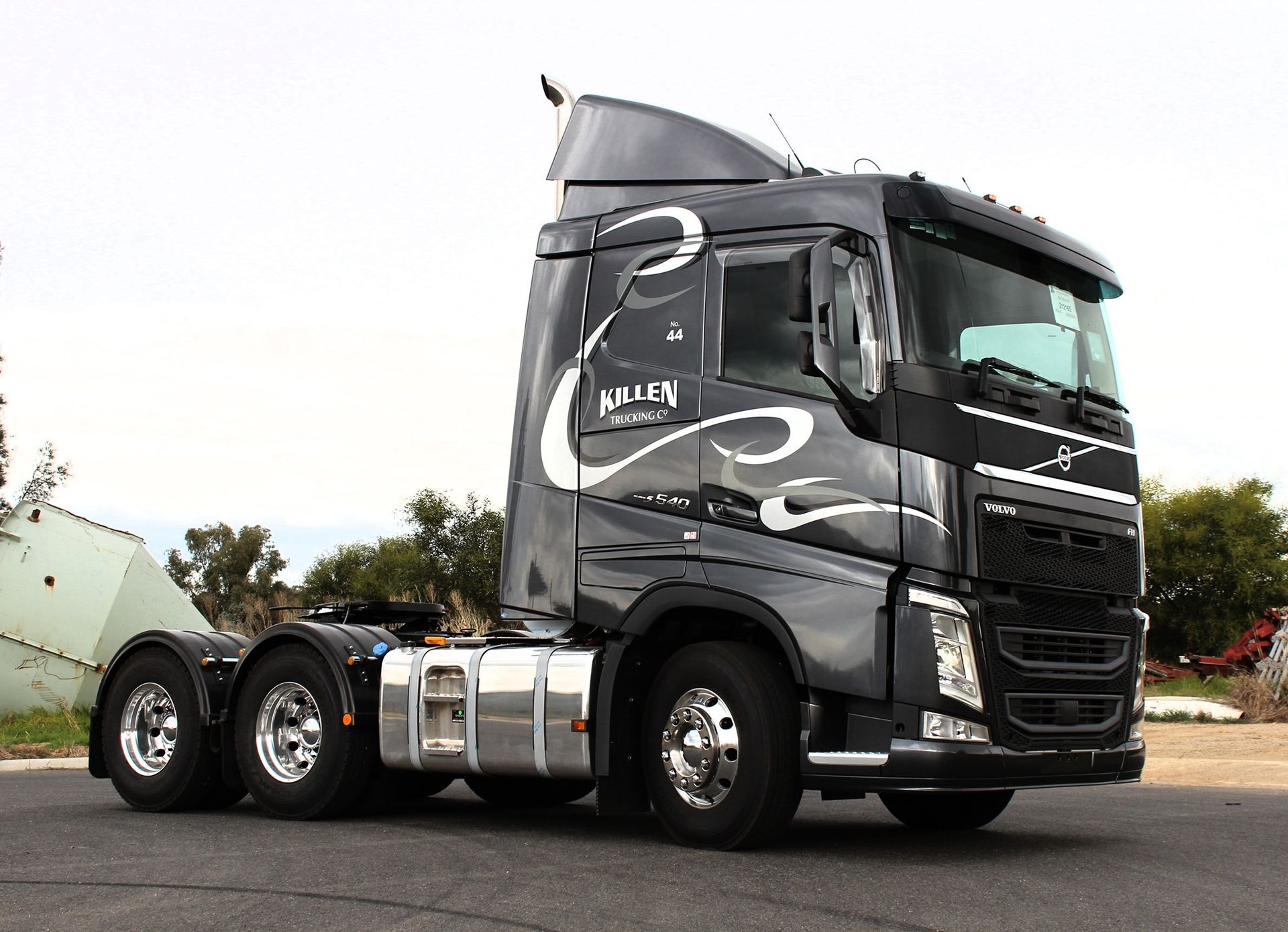 A Large Semi Truck is Parked on the Side of the Road — Robinsons Sign Makers in Lavington, NSW