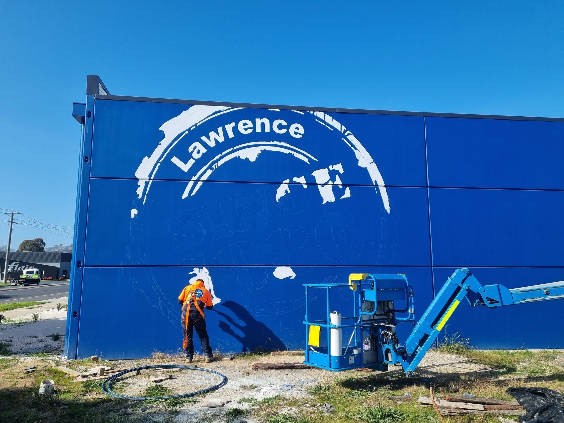A blue building with the word lawrence painted on it
