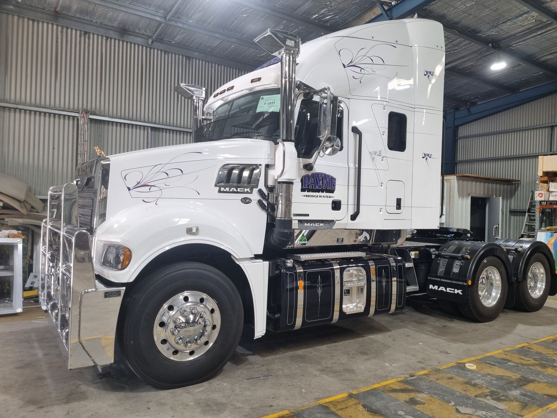 A White Semi Truck is Parked in a Warehouse — Robinsons Sign Makers in Lavington, NSW