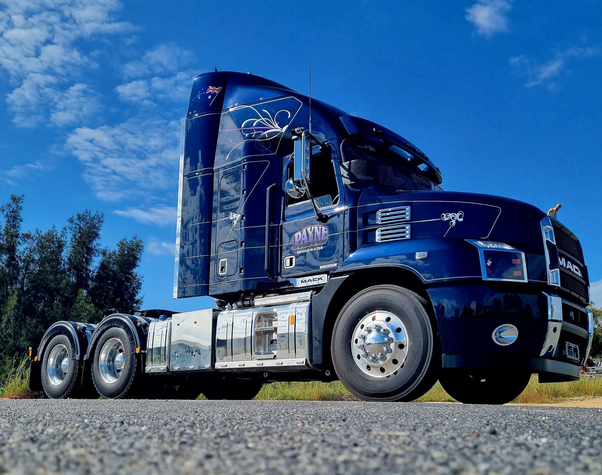 A Blue Semi Truck is Parked on the Side of the Road — Robinsons Sign Makers in Lavington, NSW
