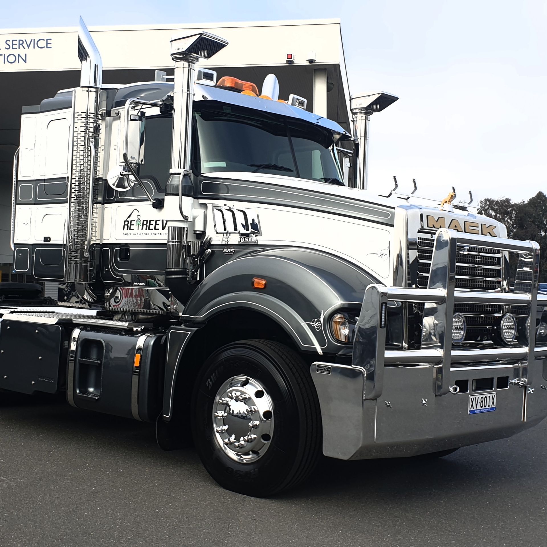 A Large Semi Truck is Parked in Front of a Service Station — Robinsons Sign Makers in Lavington, NSW