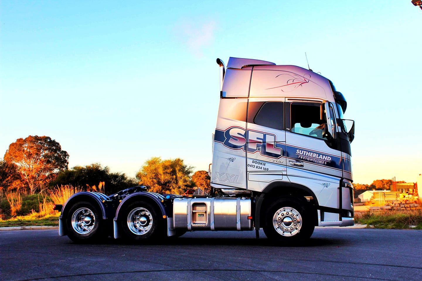 A Large Semi Truck is Parked on the Side of the Road — Robinsons Sign Makers in Lavington, NSW