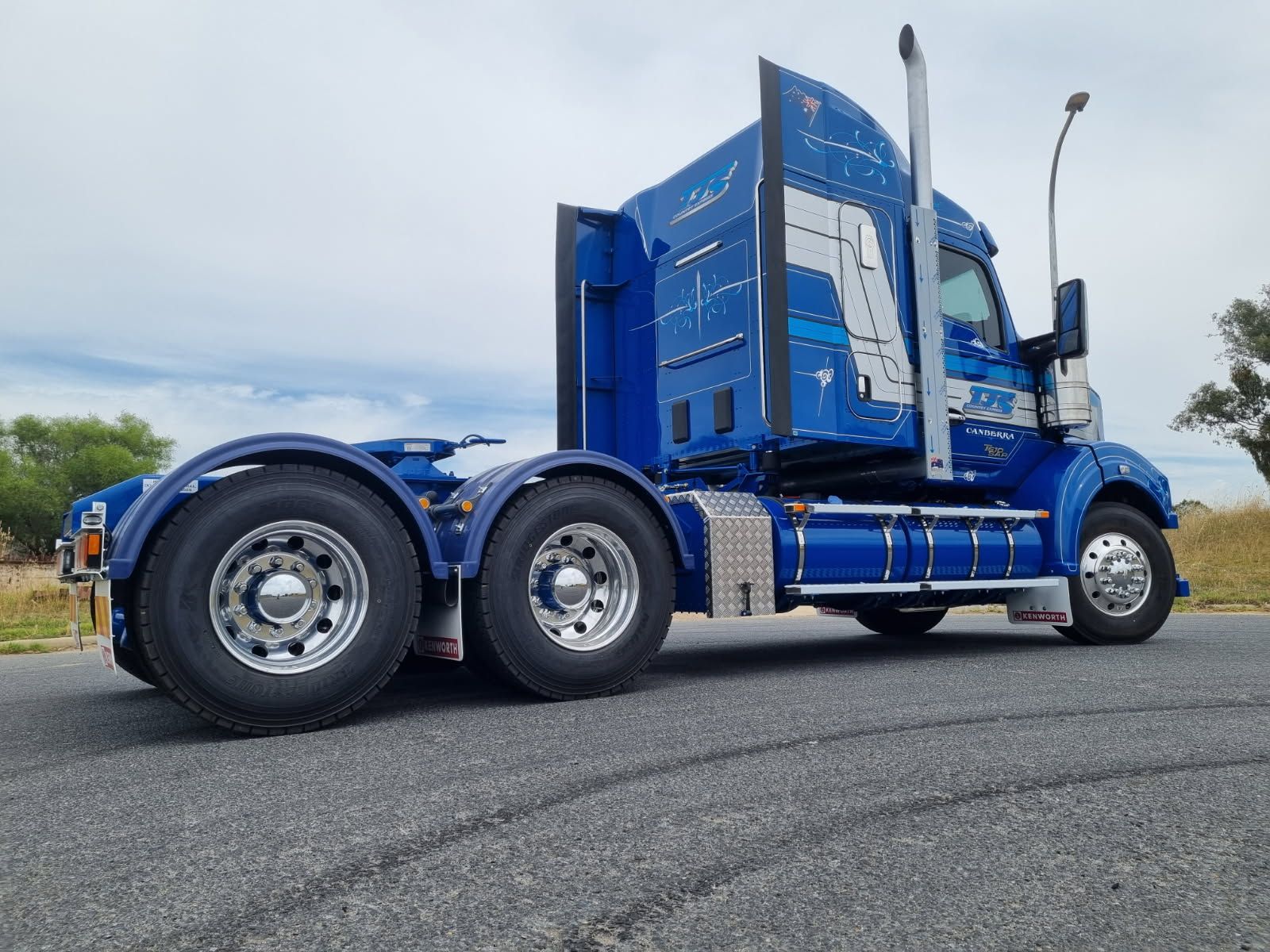 A Blue Semi Truck is Parked by the Side of the Road — Robinsons Sign Makers in Canberra, ACT