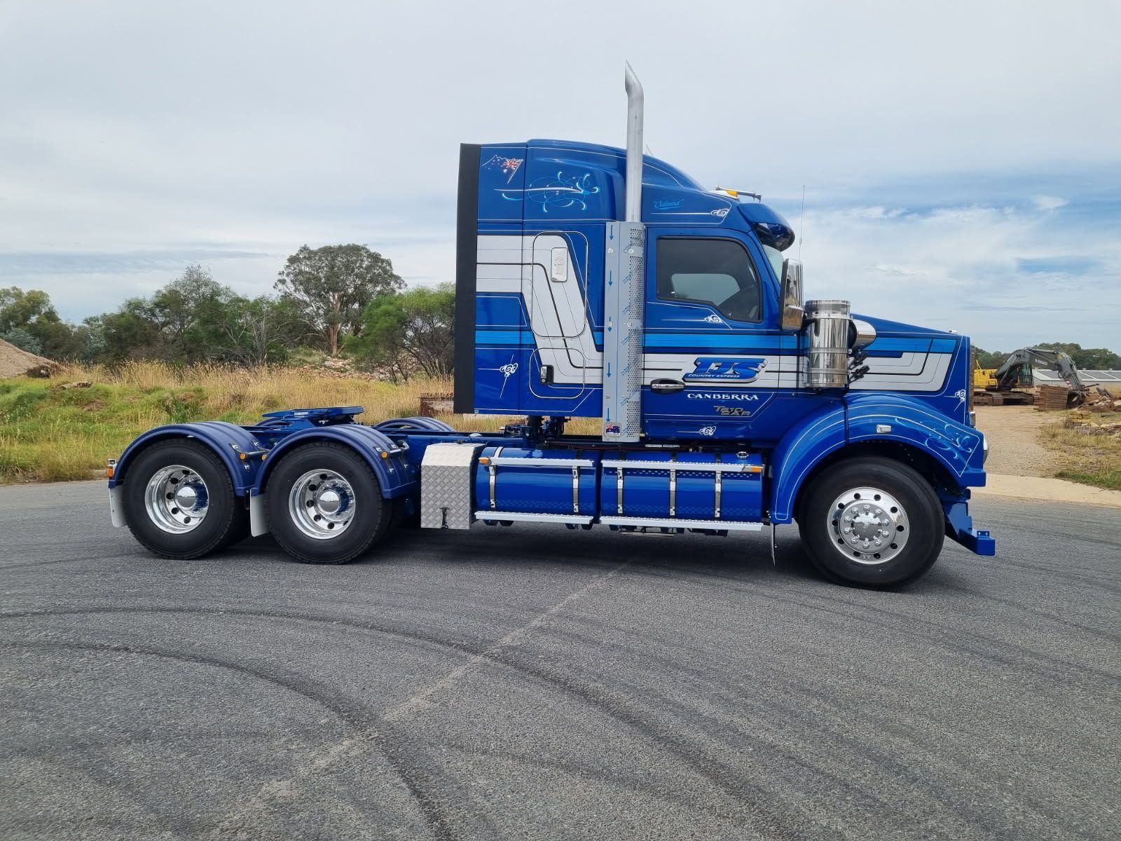 On the Side of the Road is a Blue Semi Truck — Robinsons Sign Makers in Canberra, ACT