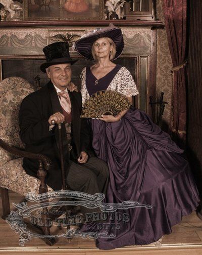 a man in a top hat sits next to a woman in a purple dress  - Miss Kitty's Old Time Photos and Gifts    Corolla Outer Banks NC