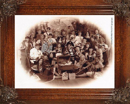 a group of people are posing for a picture in a wooden frame