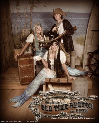 a group of people dressed in pirate costumes  - Miss Kitty's Old Time Photos and Gifts    Corolla Outer Banks NC