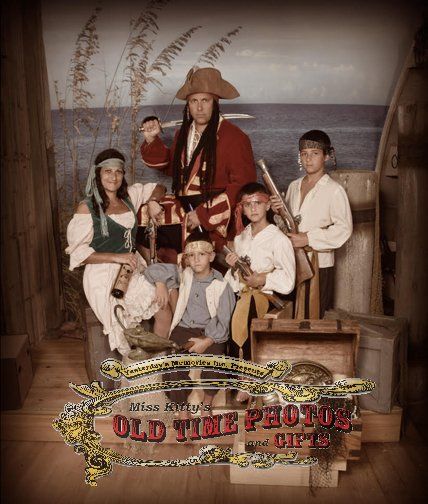 a group of people dressed as pirates are posing for a old time picture